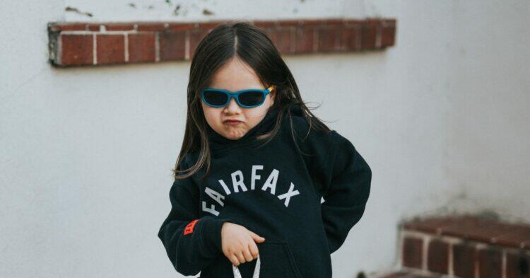 Child posing a sassy pose (Unsplash | Nathan Dumlao)