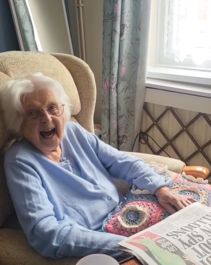 Grandma with a crocheted cushion