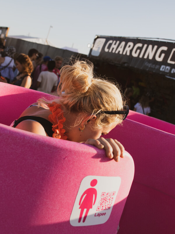 Lady using Lapee urinal