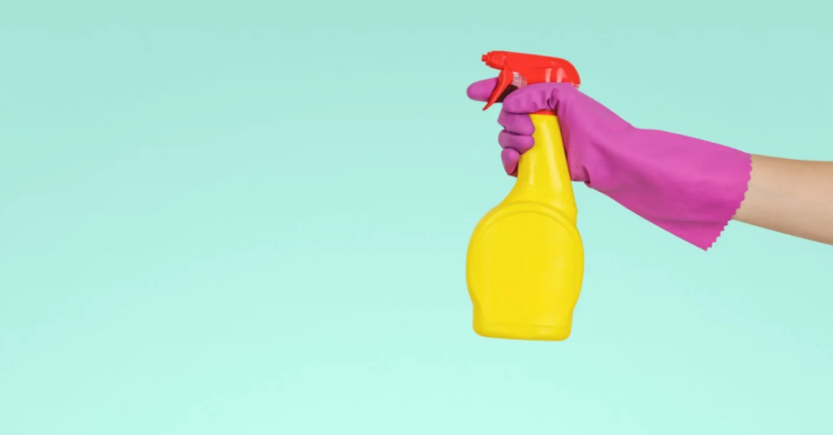 Image of hand spraying cleaning product (Unsplash)
