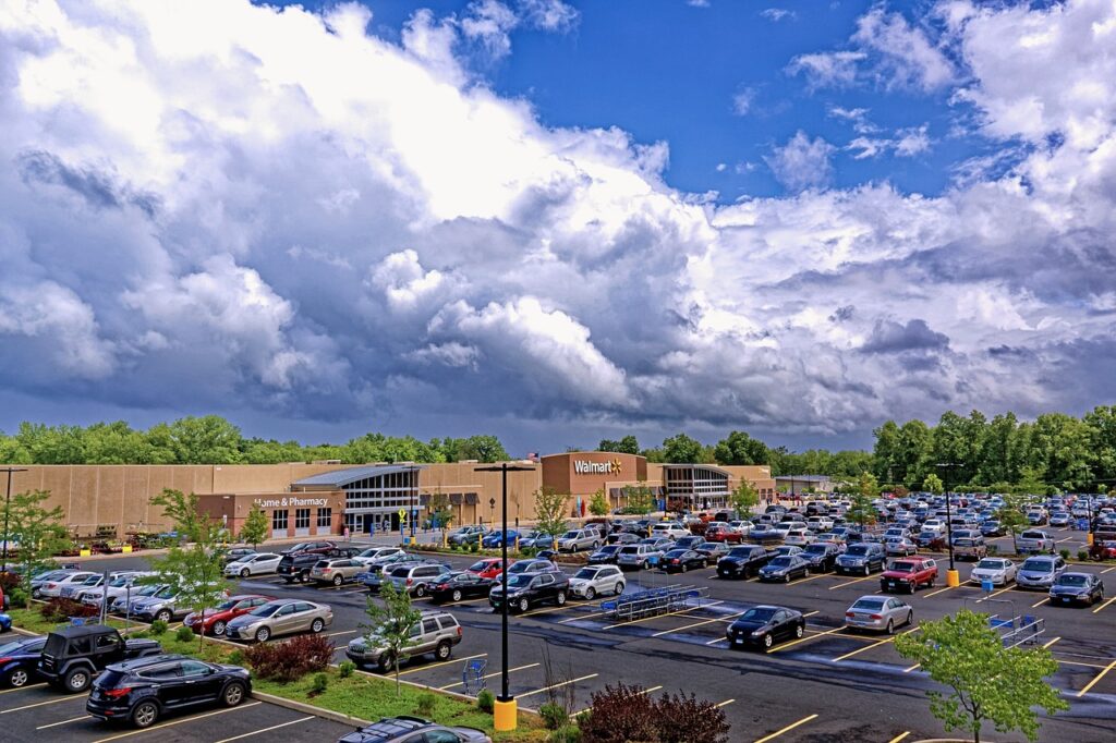 a wide shot of a Walmart store and parking lot