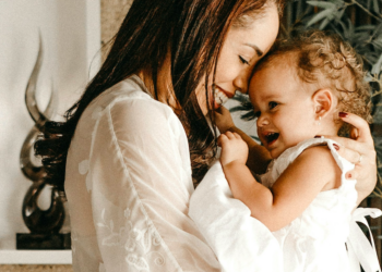 A woman holding a baby