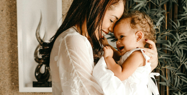 A woman holding a baby