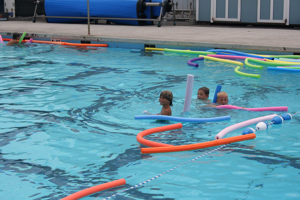 Kids swimming in a local pool