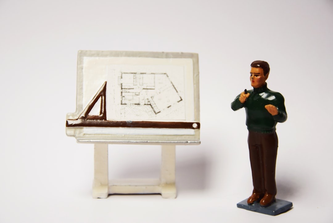 An image tiny toy man with a tiny presentation board.