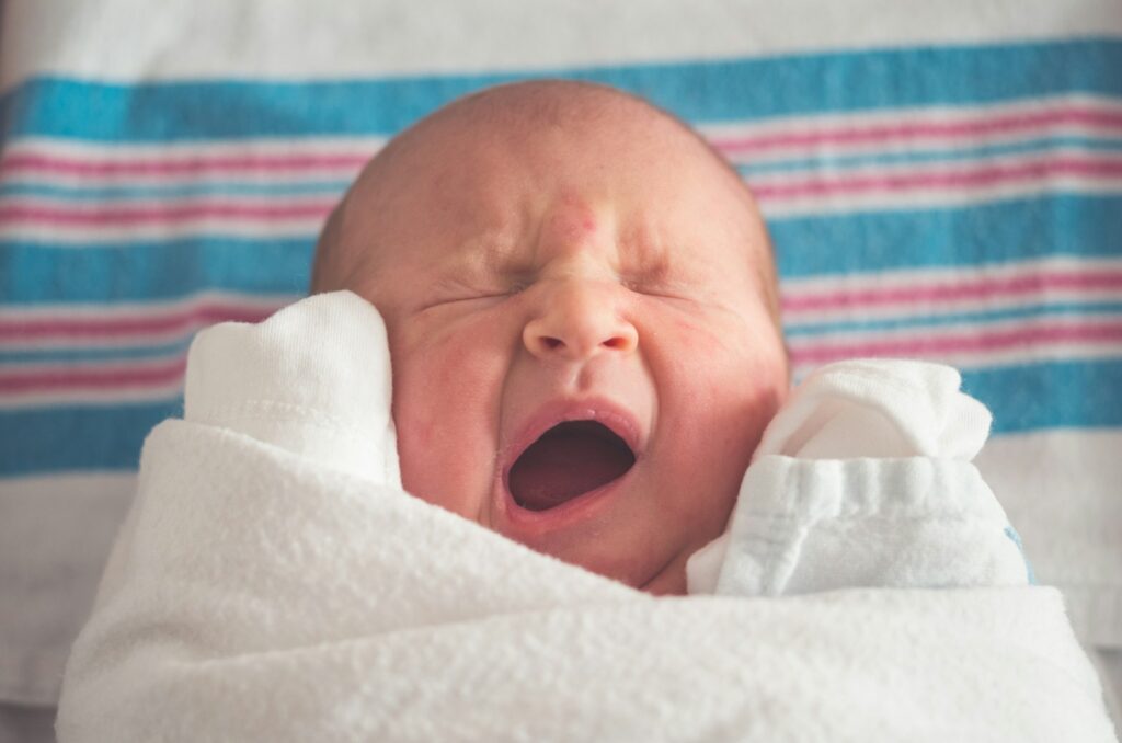 picture of a newborn baby yawning