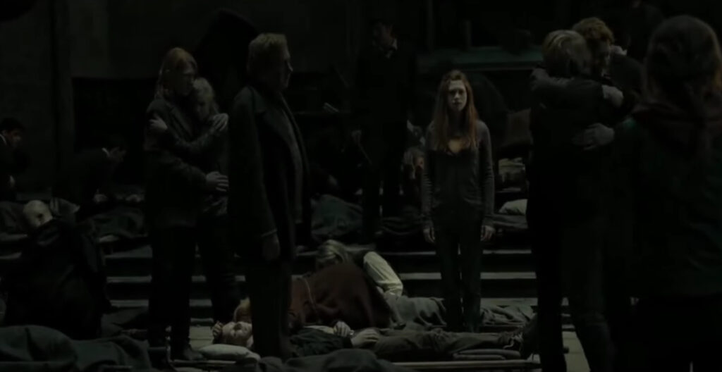 The Weasley family gathered around Fred Weasley in Harry Potter