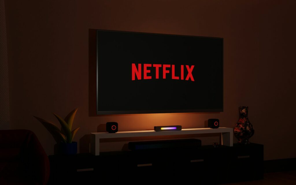 a flat screen tv sitting on top of a entertainment center