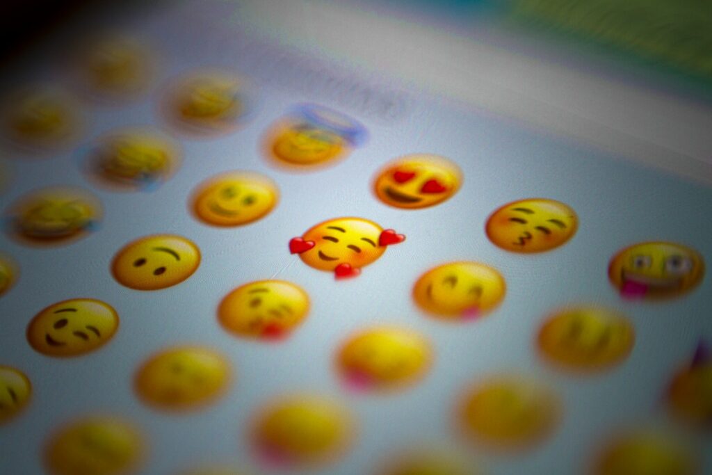 a bunch of yellow face emojis on a screen