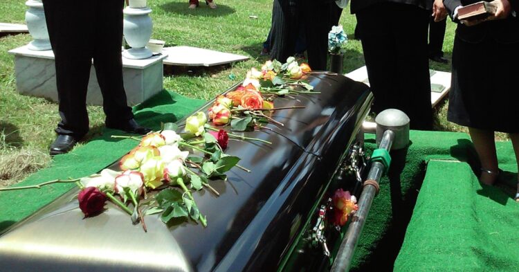 group of people attending burial
