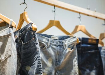 selective focus photography of hanged denim jeans