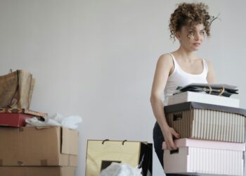 woman holding moving boxes