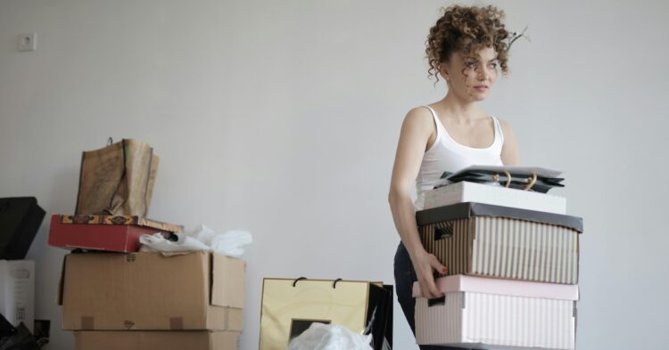 woman holding moving boxes