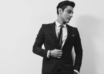 young man in a black suit