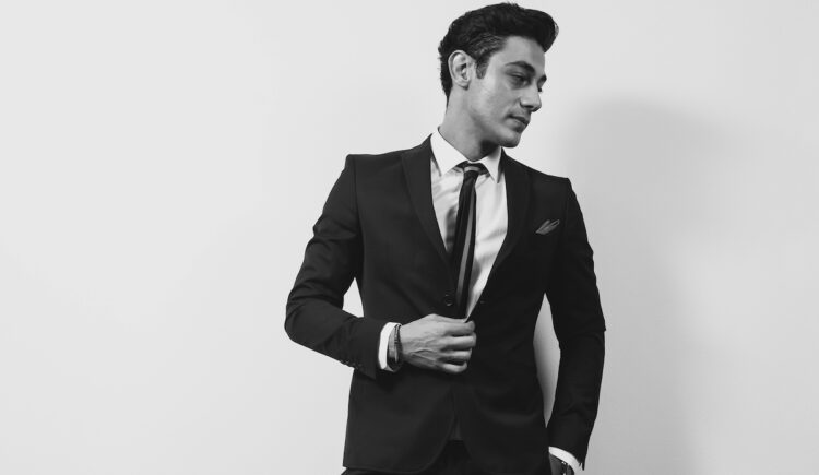 young man in a black suit