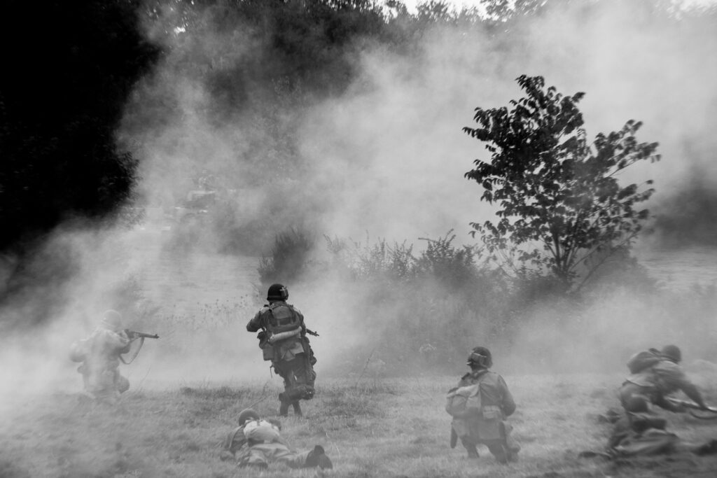 a black and white photo of a group of people in a field