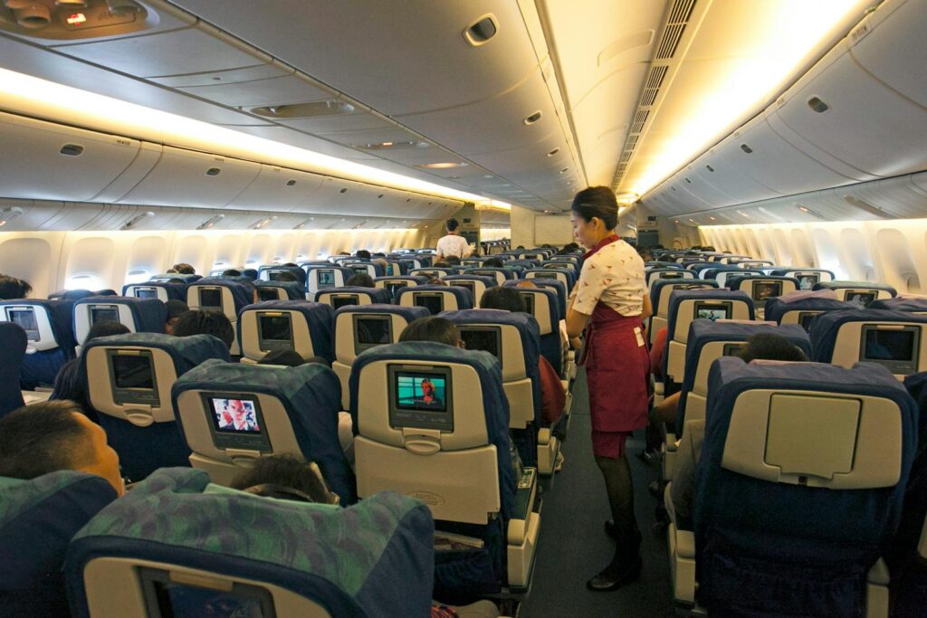 Stewardess Working on Airplane