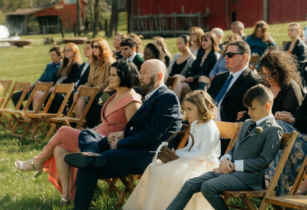 People Sitting on Chairs at Outdoor Wedding