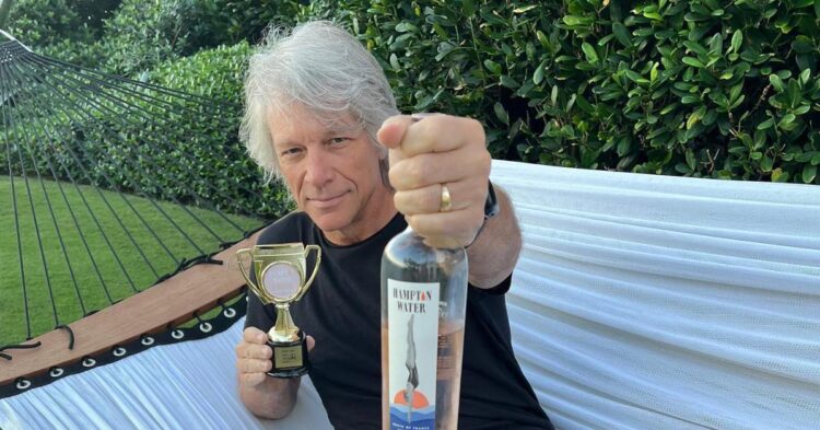 Jon Bon Jovi holding up alcohol