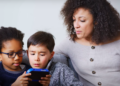Mother supervises children playing video game via YouTube