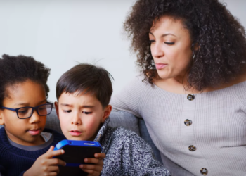 Mother supervises children playing video game via YouTube