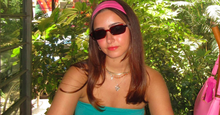 Piper Taich on vacation in sunglasses and pink headband via Instagram