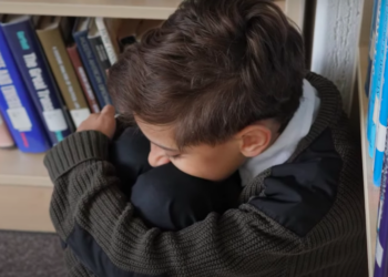 Sad child alone at school stock footage via YouTube