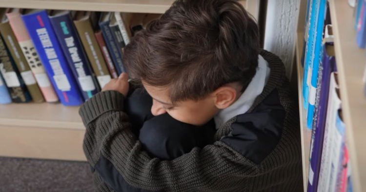 Sad child alone at school stock footage via YouTube
