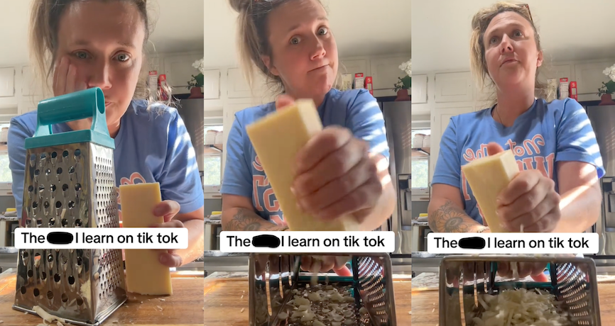 woman grating a block of hard cheese with a cheese grater