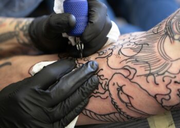 arm getting tattooed