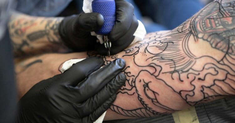 arm getting tattooed