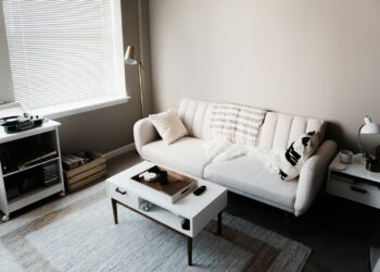 white couch in front of white wooden table