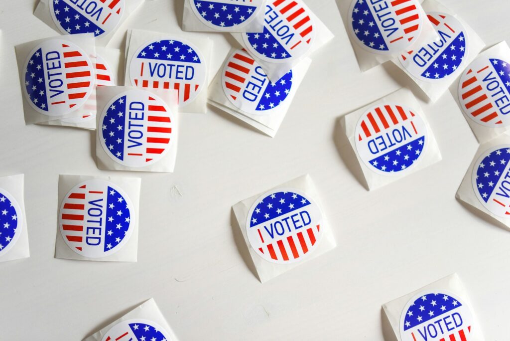 I Voted printed papers on white surface