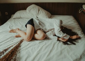 woman lying on bed