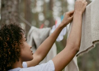 woman hanging clothes on a clothes line