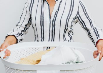 woman holding laundry basket