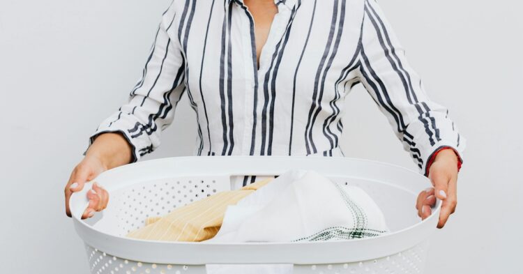 woman holding laundry basket