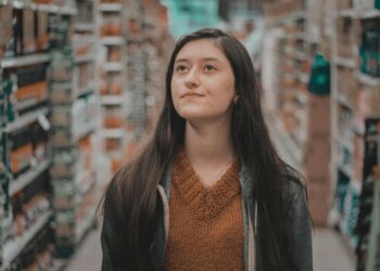 woman walking in a grocery store