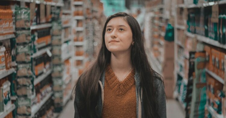 woman walking in a grocery store