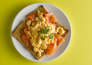 scrambled eggs with lox on a toast