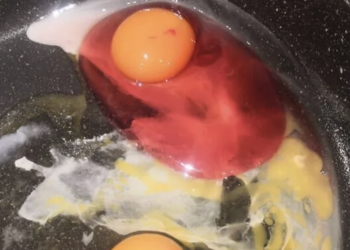 pink egg in a frying pan