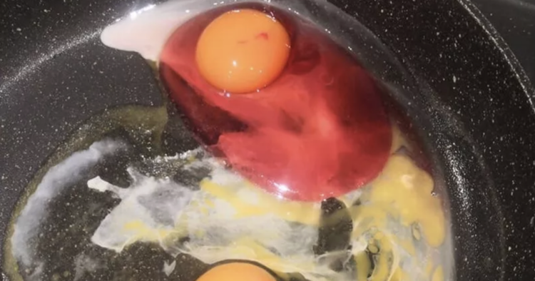 pink egg in a frying pan