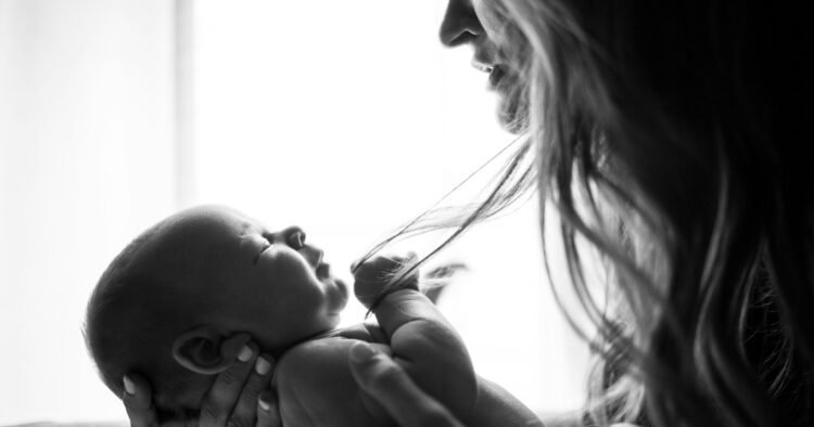 mom holding newborn baby