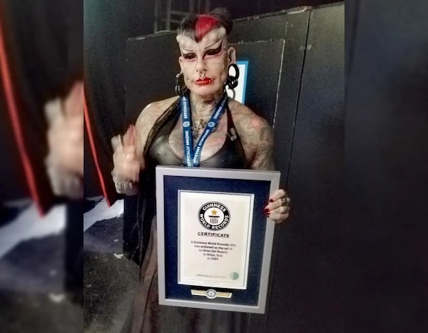 Maria José Cristerna Méndez holding her Guinness World Record