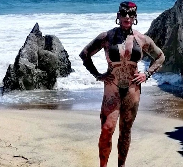 Maria José Cristerna Méndez on a beach