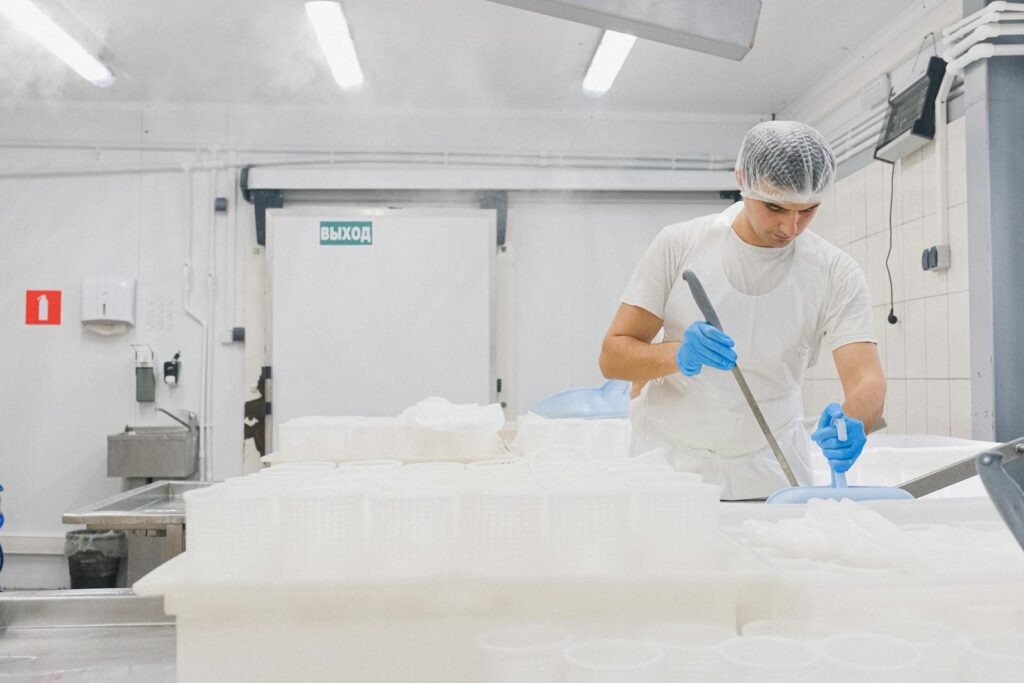 Man Working at Cheese Factory