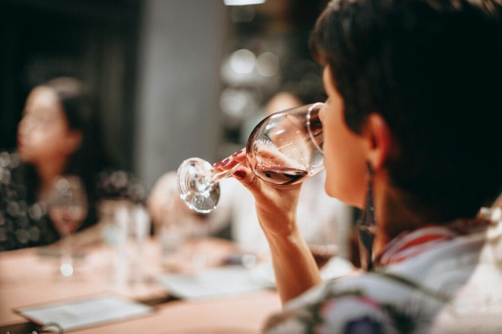 Person Drinking Wine at a table