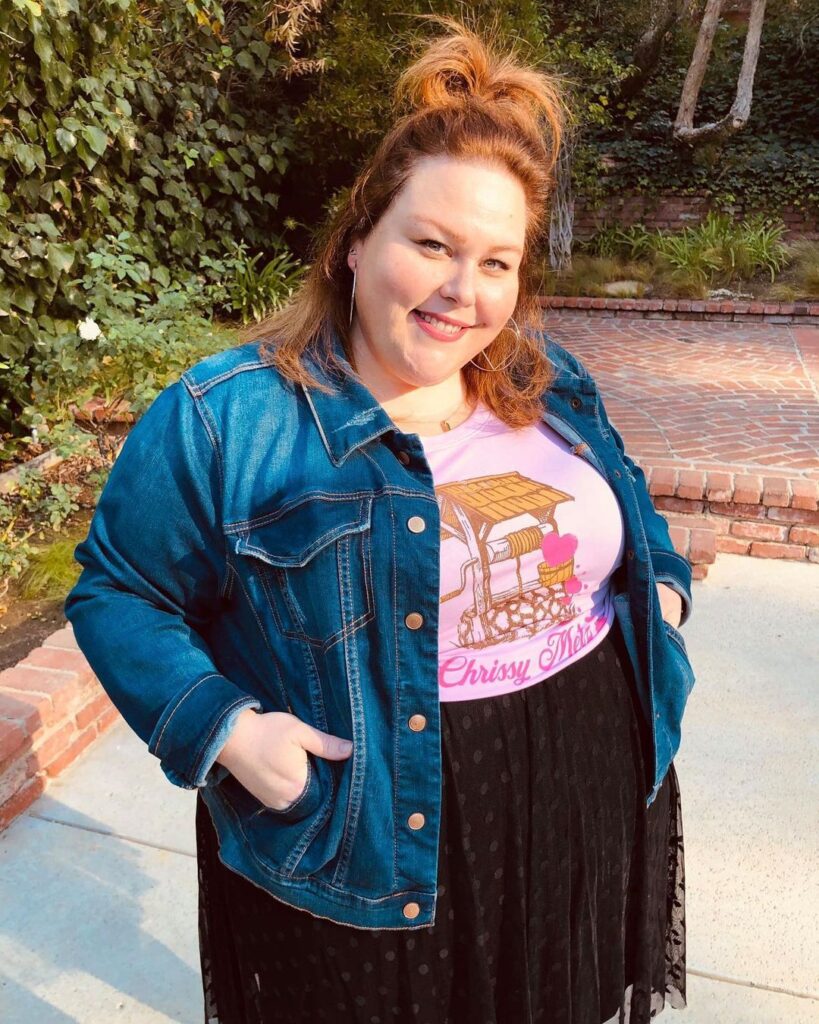 chrissy metz smiling in. a jean jacket