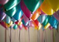 selective focus photography of assorted-color balloons
