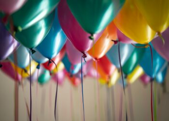 selective focus photography of assorted-color balloons